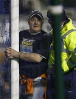 Fan Handcuffs Himself to Soccer Goa