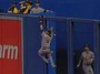 A's Outfielder Scales Fence to Make Grab