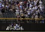 Carlos Gonzalez Makes Catch, Crashes into Wall